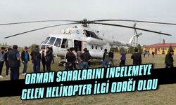 Orman sahalarını incelemeye gelen helikopter ilgi odağı oldu